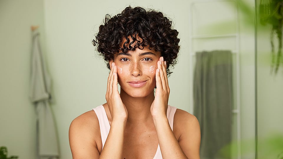 woman applying face cream